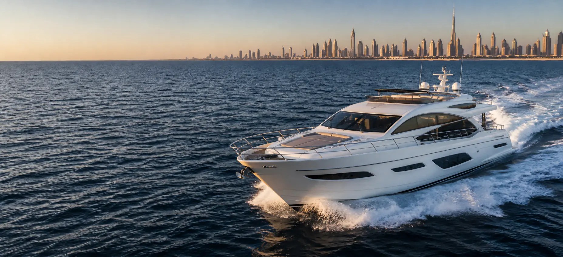Private luxury yacht cruising beside the Dubai skyline